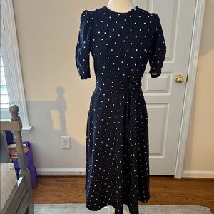 Elegant Navy Polka Dot Dress with self-tie belt.

Excellent condition.